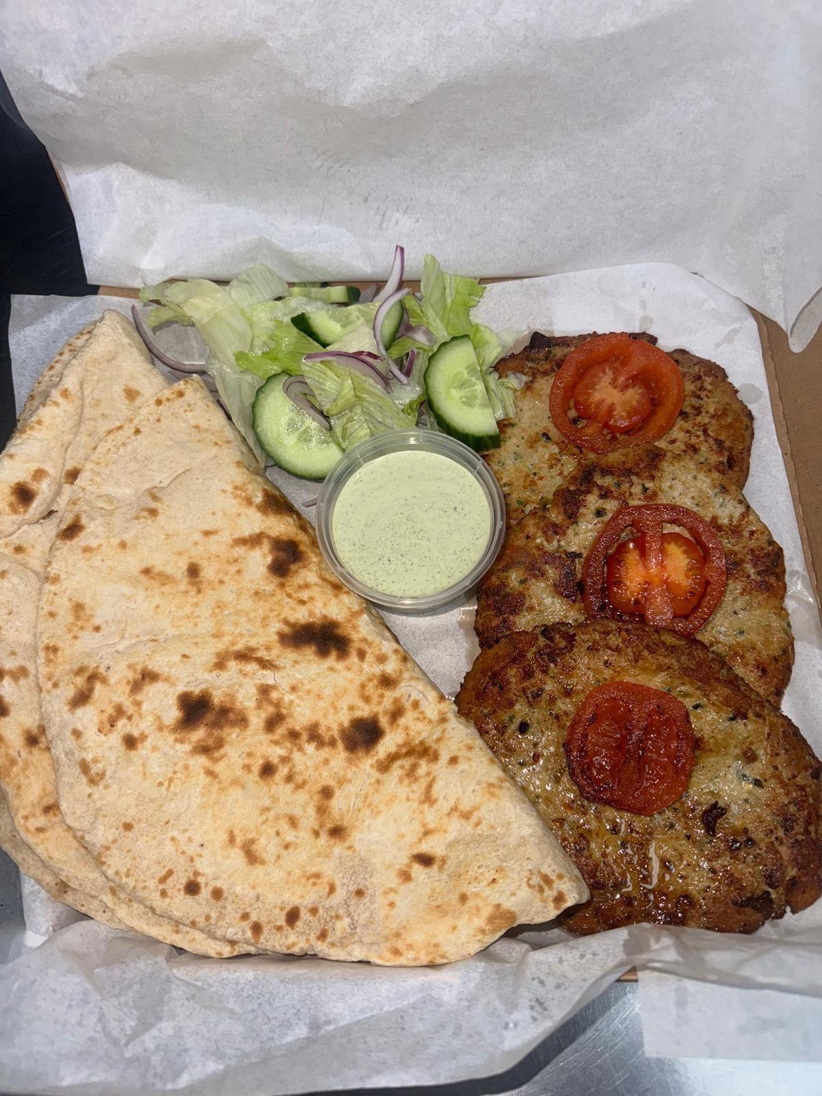 Chapli kebab meal with naan, salad and mint sauce