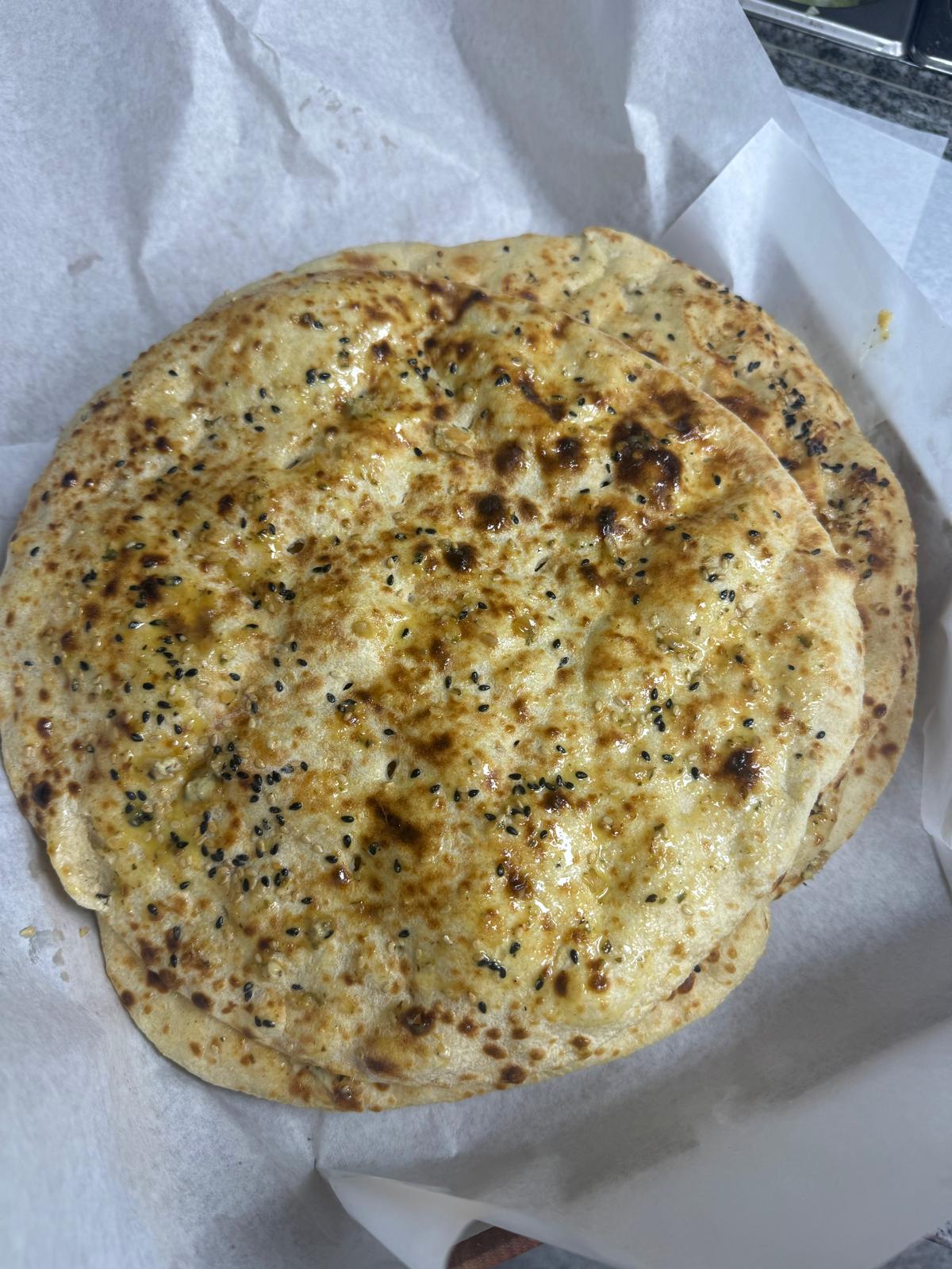 Fresh naan bread with nigella and sesame seeds
